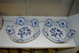 A pair of Meissen blue and white floral decorated baskets with pierced sides.