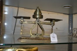 A set of postal scales and weights.