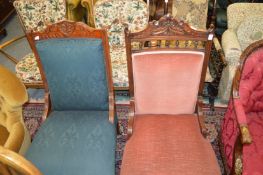 Two Victorian walnut framed and upholstered chairs.