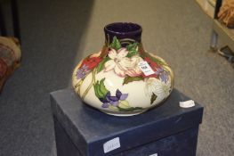 A Moocroft large squat shaped floral decorated vase with original box.