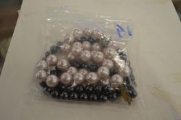 A two colour pearl necklace.