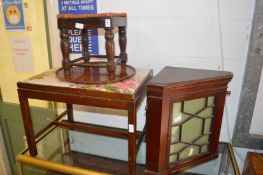Two mahogany stools, a table top and a corner cabinet.