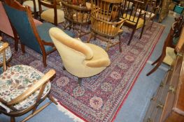 A large red ground Persian style carpet.