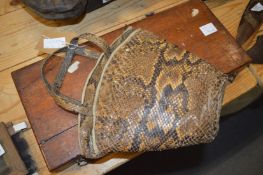 A snakeskin bag.