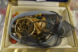 A box of costume jewellery.