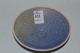 A small Chinese circular bowl incised with fish.