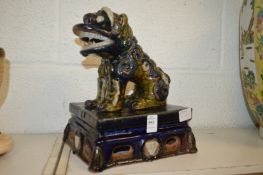 A Chinese Sancai pottery lion.