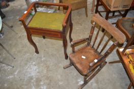 A child's rocking chair and a piano stool.