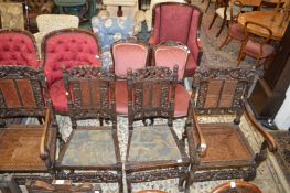 A matched set of four 17th century style carved walnut dining chair, two with arms, all with cane
