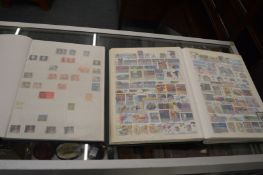 Stamps, two albums containing numerous Canadian stamps.