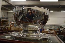 A plated punch bowl with similar tray.
