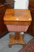 A 19th century rosewood sewing table.