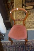 A set of four Victorian mahogany balloon back dining chairs.