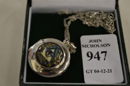 A decorative pendant and chain.