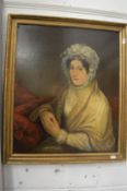 A portrait of a seated lady wearing a bonnet and a shawl, oil on canvas in a decorative gilt frame.