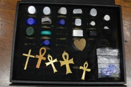 A case containing numerous aluminium and wax signet ring blanks and other patterned jewellery