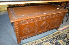 A carved oak coffer.