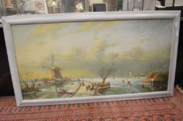 Dutch school, a winter landscape with a frozen river, a windmill and figures on a path, oil on