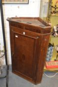 A 19th century oak hanging corner cupboard.