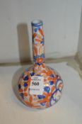 A small Imari style porcelain bottle vase.