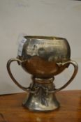 An Art Nouveau silver three handled pedestal trophy cup.