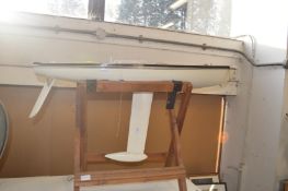 A sailing ship's hull on a stand.