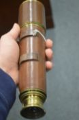 A leather covered brass telescope.