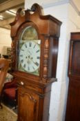 A 19th century oak cased eight day long case clock with painted arch dial, signed Smith, Walton.