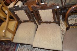 A pair of late Victorian dining chairs.