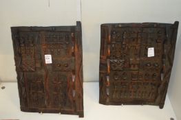 A pair of African carved wood small doors.
