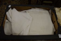 Various table cloths and other linen.