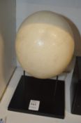 An emu egg on stand.