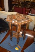 An eastern inlaid hexagonal shaped table.