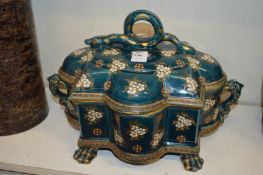 A continental turquoise glazed pottery box and cover, the handle modelled as a serpent.