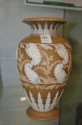 A Royal Doulton silicon ware vase with applied decoration.