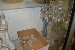 A glass three branch, four light candelabra, the base modelled as a classical female figure.