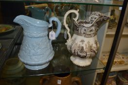 Two large decorative jugs.