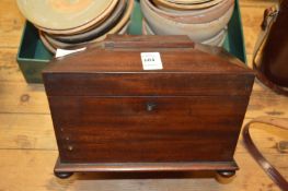 A Victorian mahogany tea caddy.