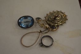 A silver ring and a decorative brooch etc.