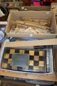A lacquer folding chess box and various other games, wind chimes etc.