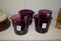 Four 19th century amethyst glass wine coolers.