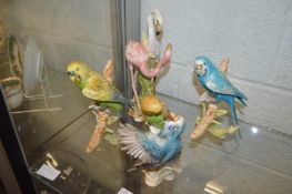 A group of Goebel models of budgies and flamingos.