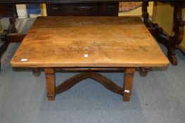 A French fruitwood low table with sliding top to reveal a storage base.