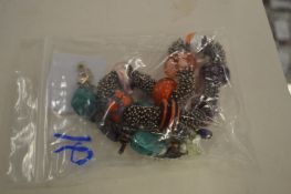 Two decorative bracelets and a brooch.