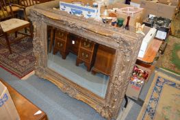A large decorative gilt framed mirror.