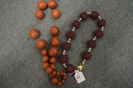 Two chunky bead necklaces.