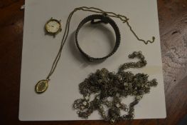 A bag of costume jewellery.