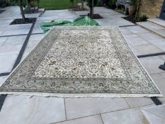 A good large Persian design cream ground hunting pattern carpet.