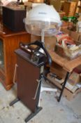 A trouser press, a floor standing hair dryer, a hi-fi system.