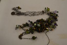 A Kirsten Goss pendant and chain.